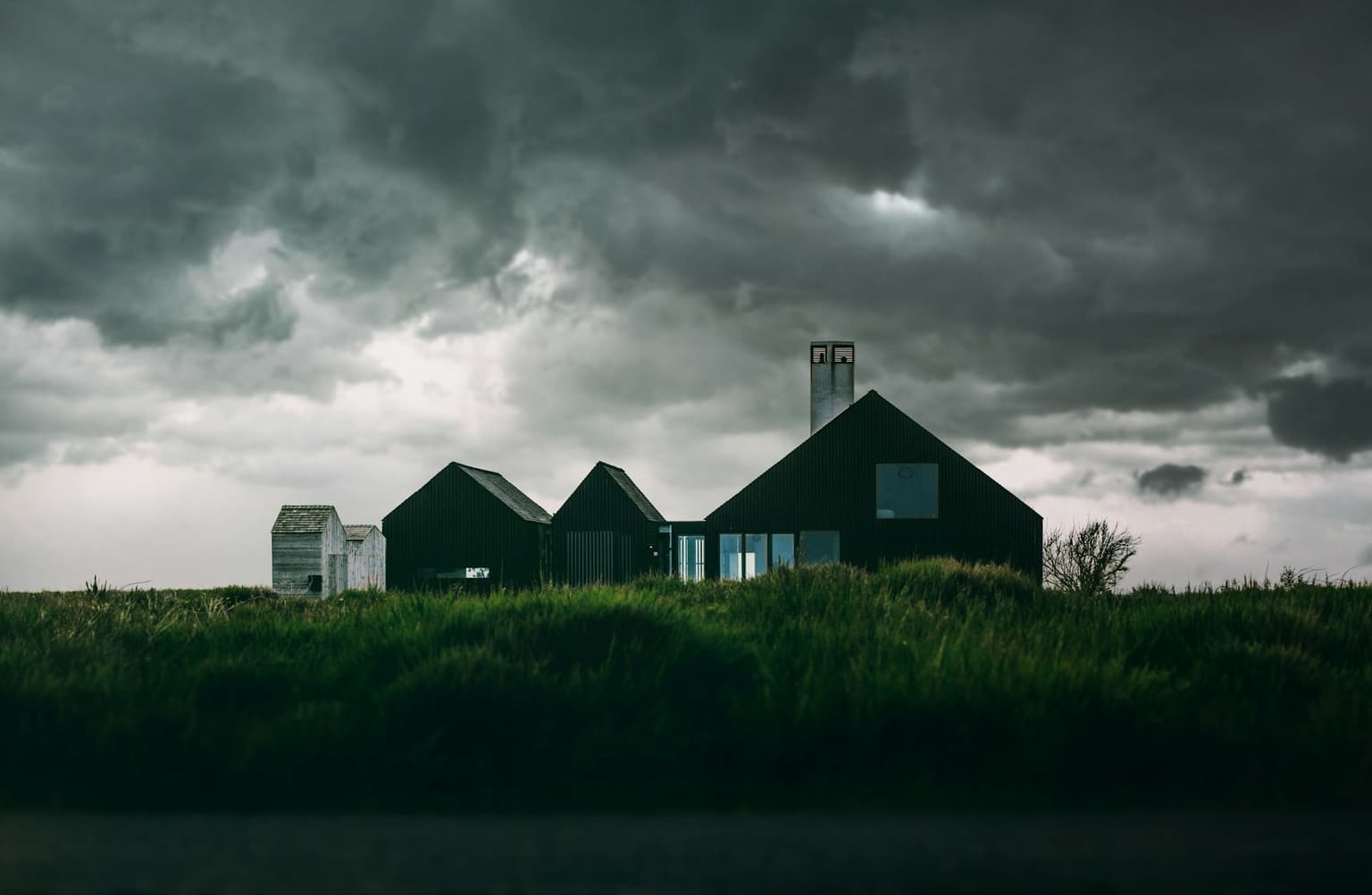 Homes under a dark storm sky in the Greater Toronto Area